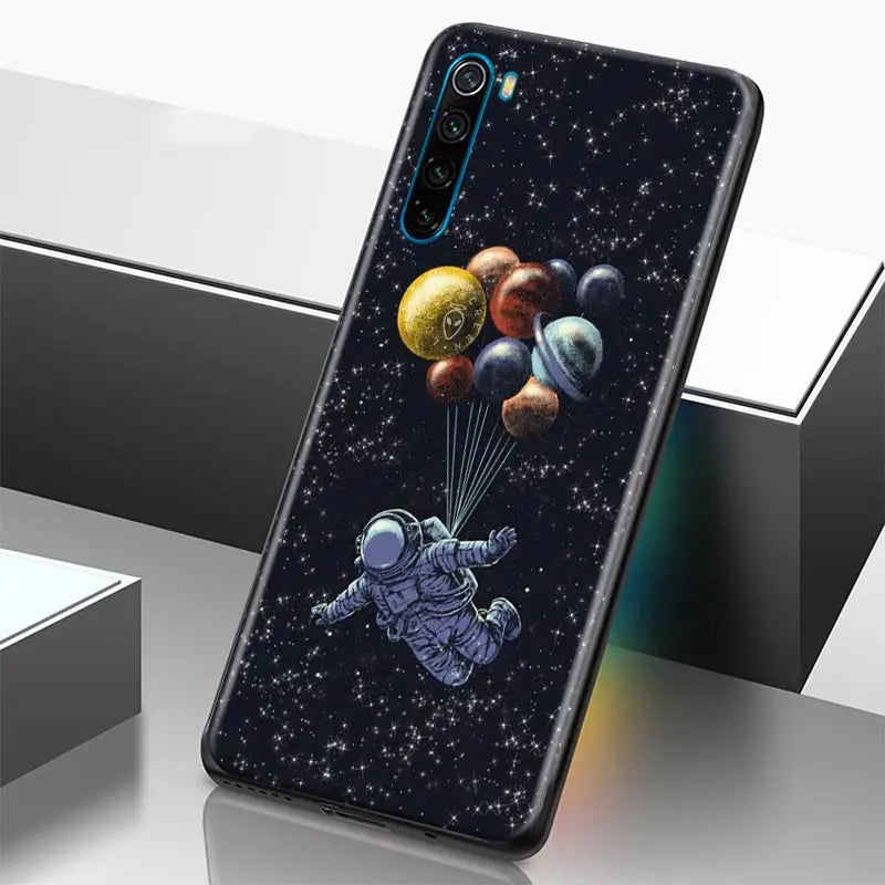 a phone case with an astronaut floating in space