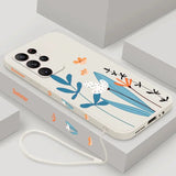 a phone case with a bird and flowers on it