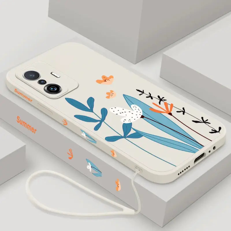 a phone case with a bird and flowers on it