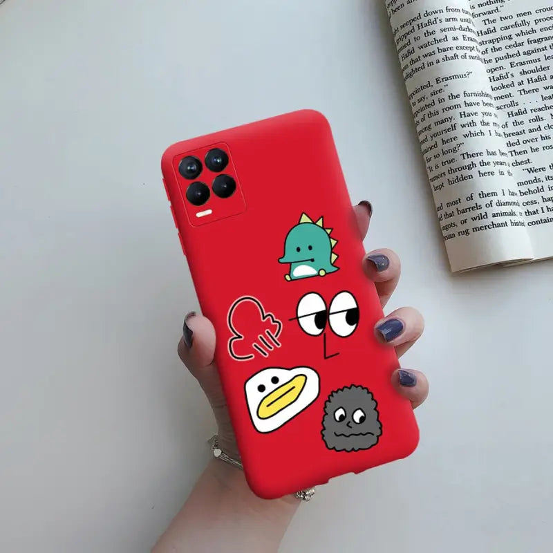a hand holding a red phone case with a bird on it