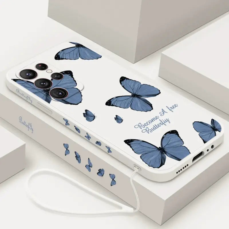a phone case with blue butterflies on it