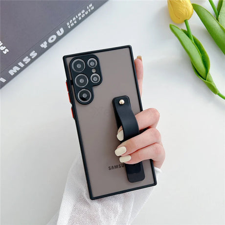 A phone case with a built-in strap for a Samsung phone.