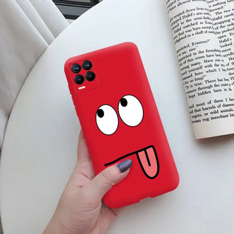 a red phone case with a cartoon face on it