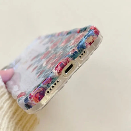 a phone case with a colorful painting on it