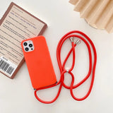 there is a red phone case with a red cord attached to it