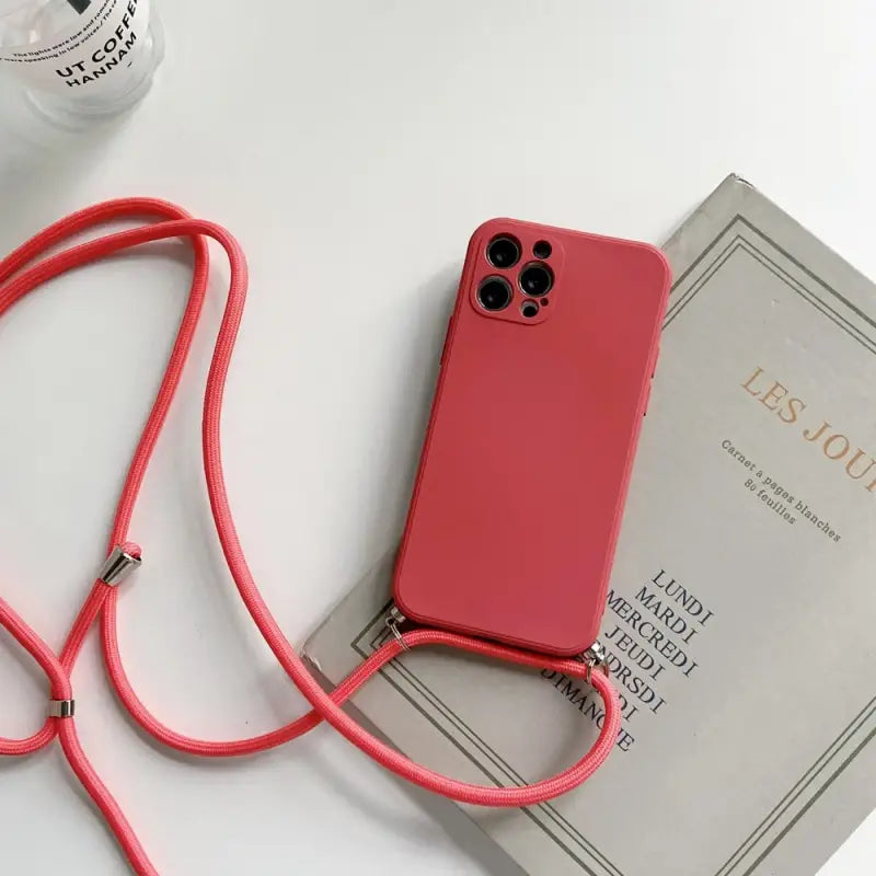 a red phone case with a red cord