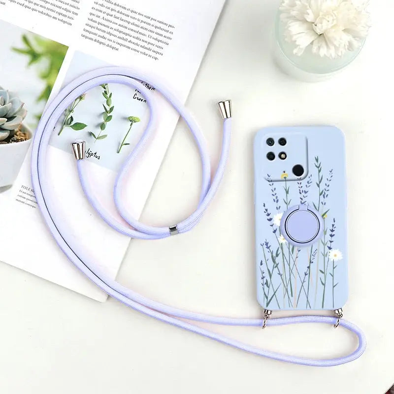 a phone case with a strap and a flower