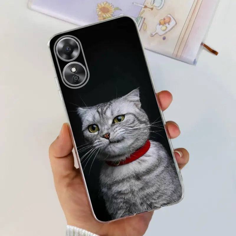a cat with a red collar is shown on a phone case