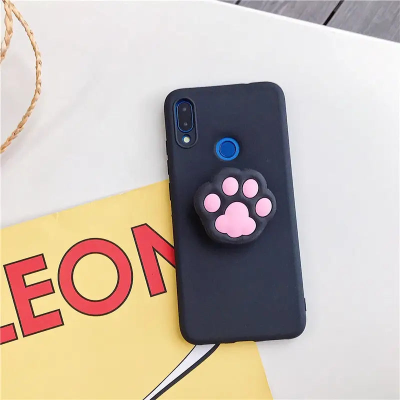 a phone case with a cute cat face