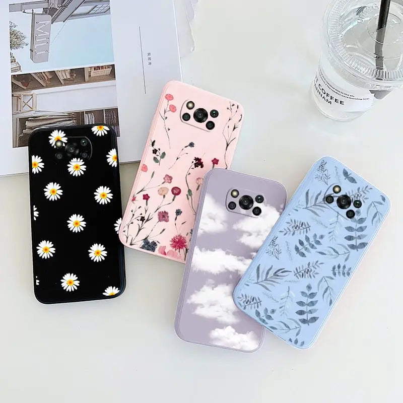 a phone case with flowers and clouds on it