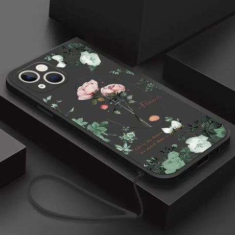 A phone case with flowers and leaves on it