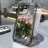 a flower in a clear case on a table