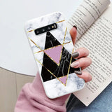 someone holding a phone case with a geometric design on it