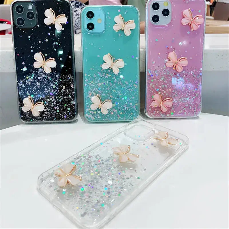 A phone case with glitter and butterflies