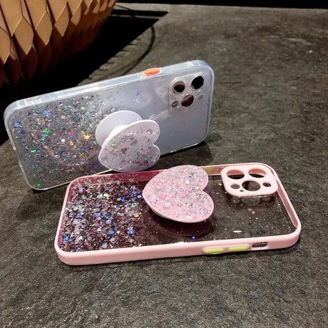 A phone case with glitter and heart shaped phone