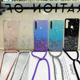 a phone case with glitter and a phone strap