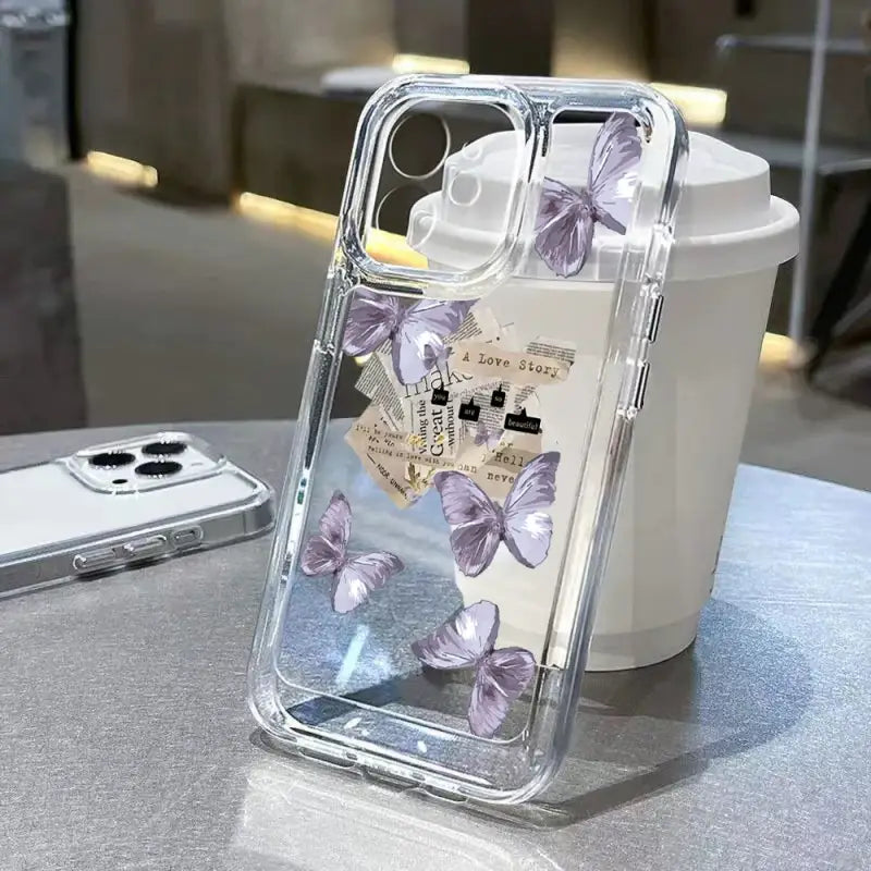 a phone case with a heart and butterflies