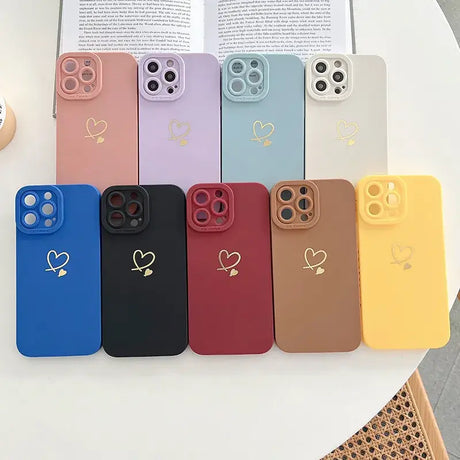 A phone case with heart and heart charms