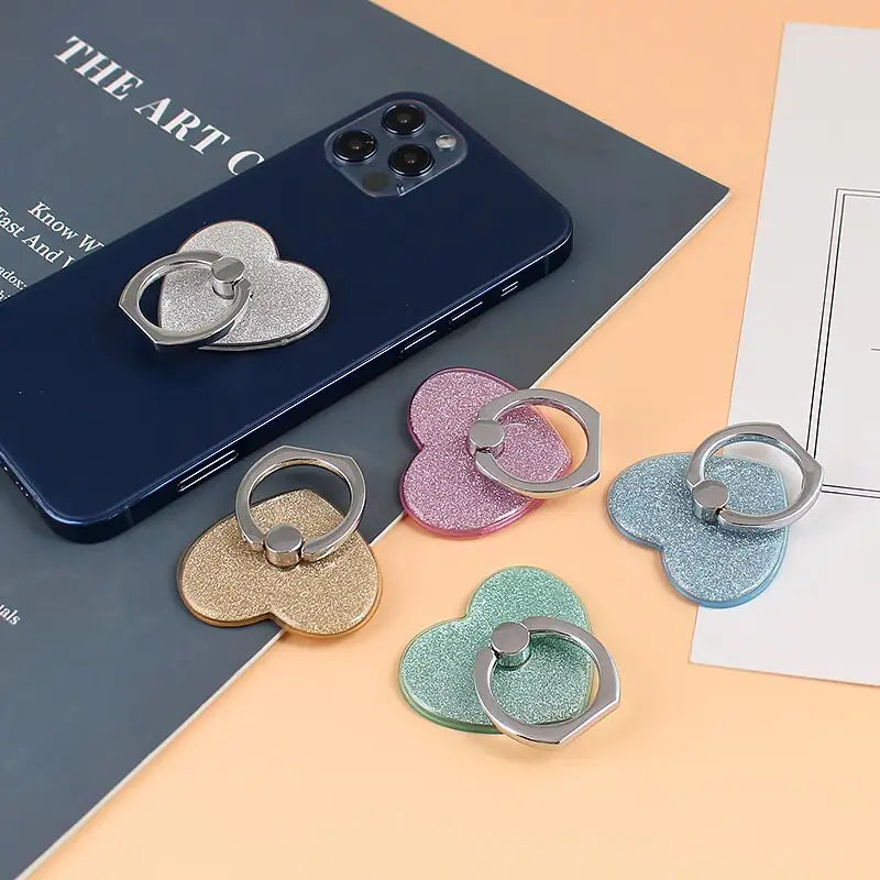 a phone case with a heart shaped phone holder