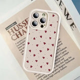 a phone case with hearts on it