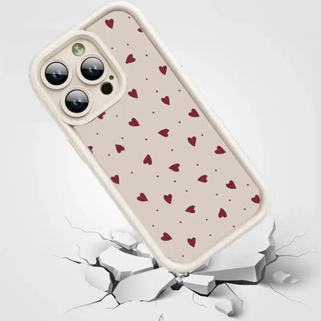 a phone case with hearts on it