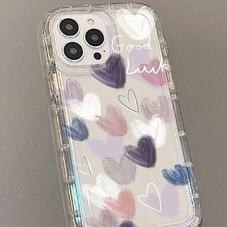 A phone case with hearts painted on it