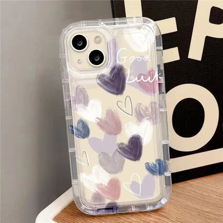 a phone case with hearts painted on it