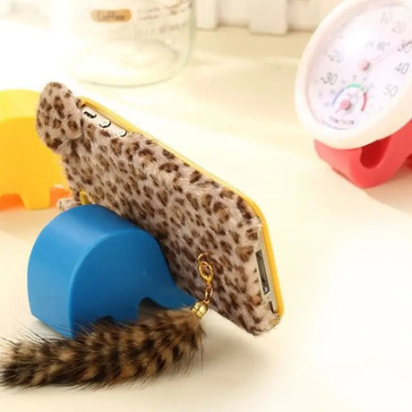 a phone case with a feather on it