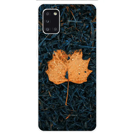 A phone case with a leaf on it