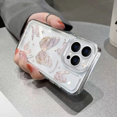 a woman holding a phone case with butterflies on it