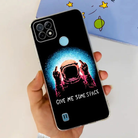 a person holding a phone case with a spaceman on it