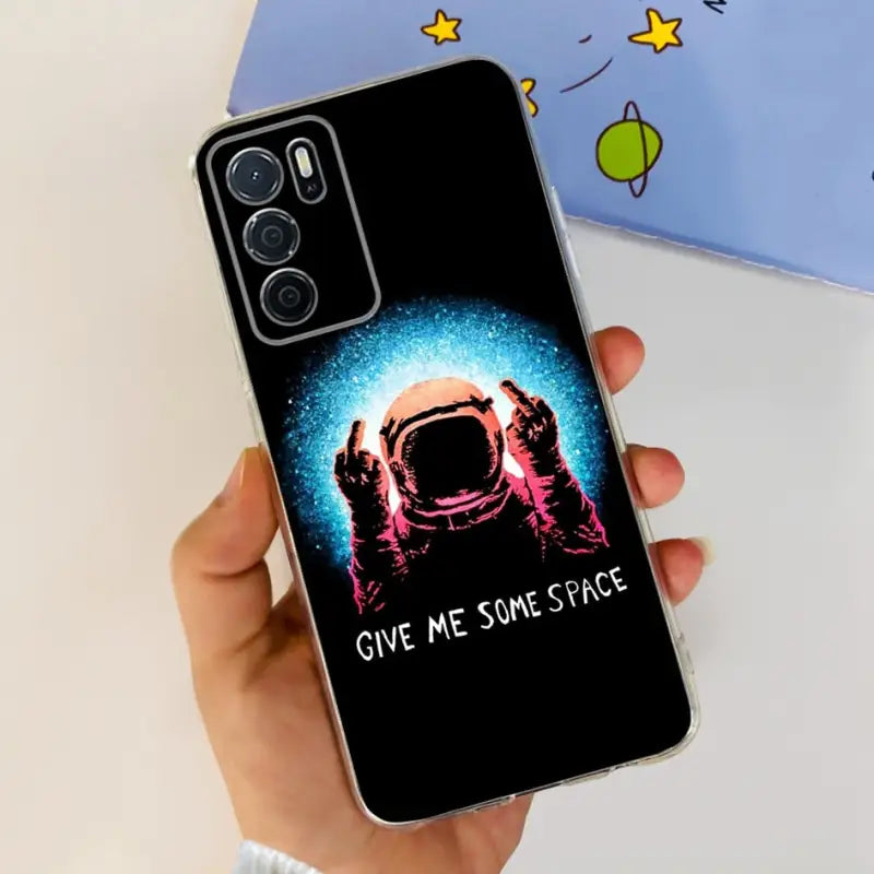a person holding a phone case with the words give me space