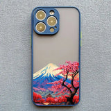 a phone case with a painting of a cherry tree and mountains