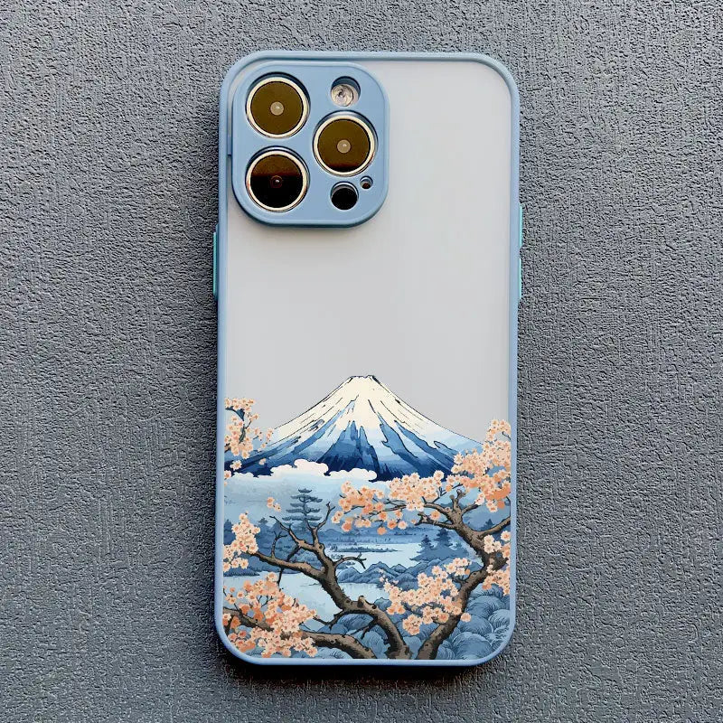 a phone case with a painting of a mountain and cherry blossoms