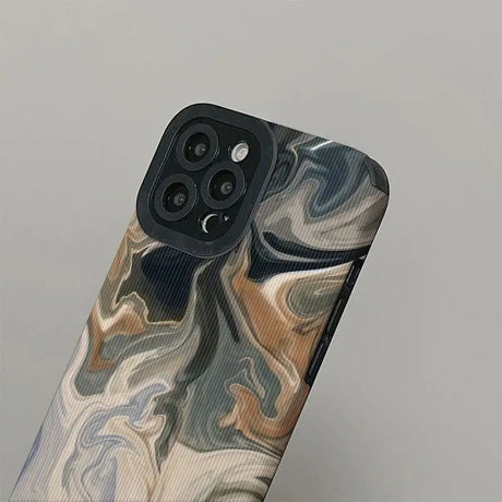 the back of a phone case with a marble pattern