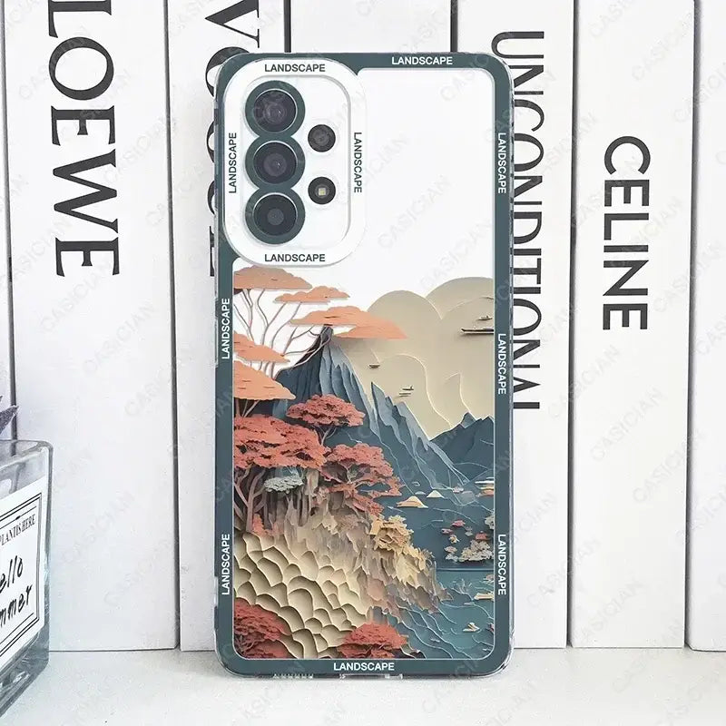 the back of a phone case with a painting of mountains and trees