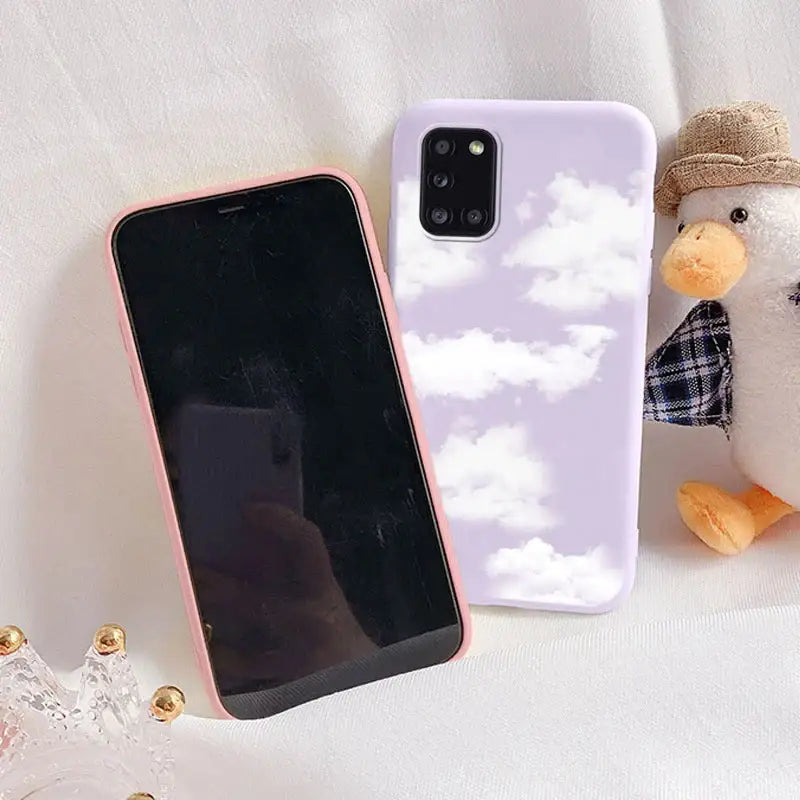 a phone case with a picture of a bird and a teddy bear