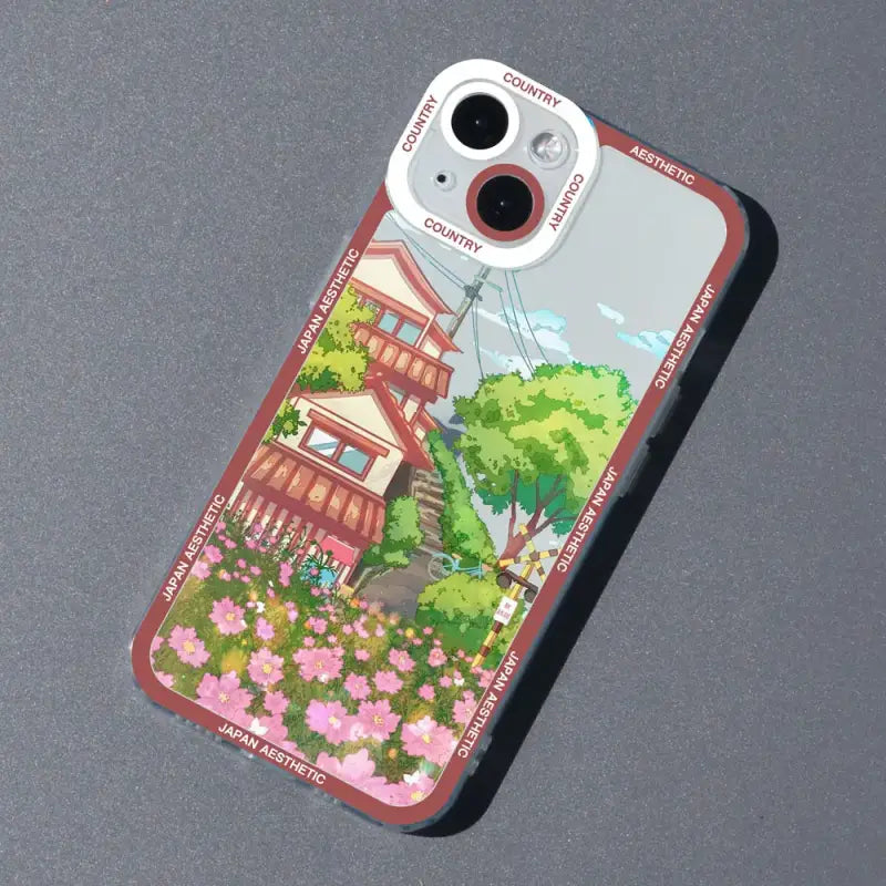 a phone case with a picture of a house and flowers