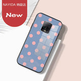 a phone case with a pattern of pink dots on it