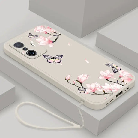 a phone case with pink flowers and butterflies