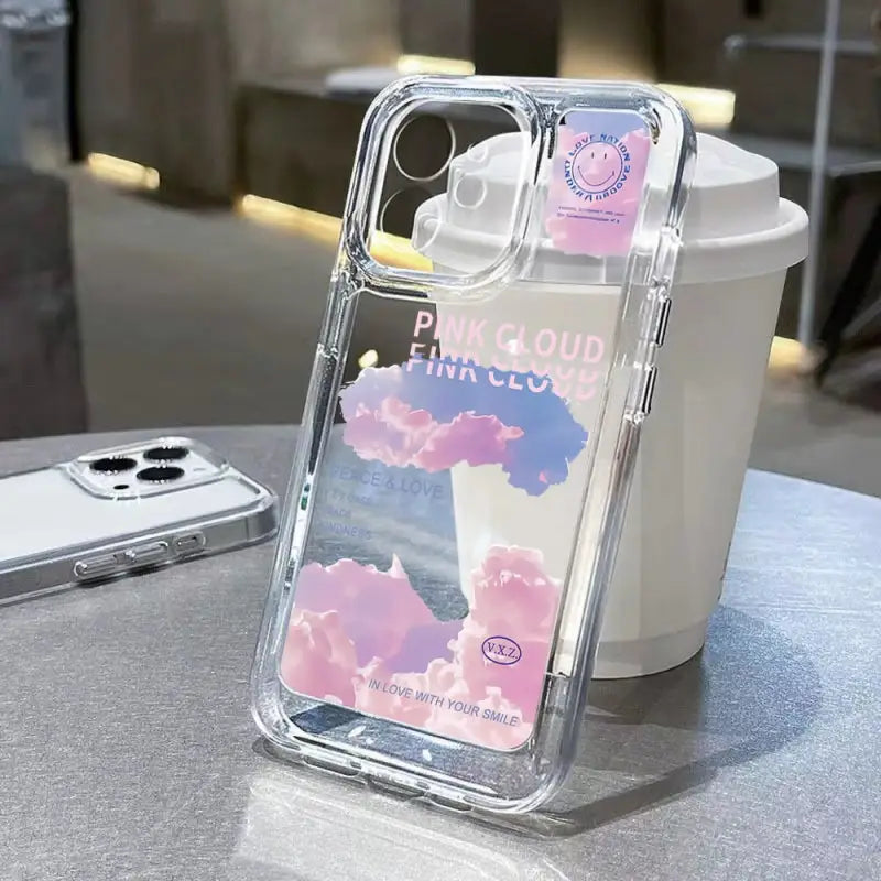 a phone case with a pink cloud design on it