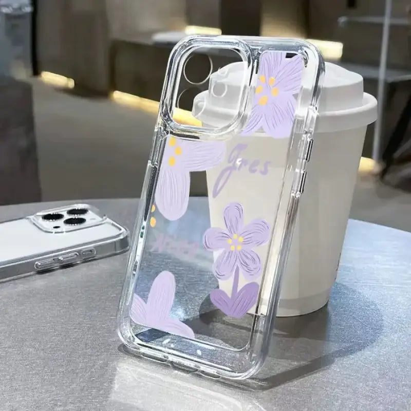 a phone case with purple flowers on it