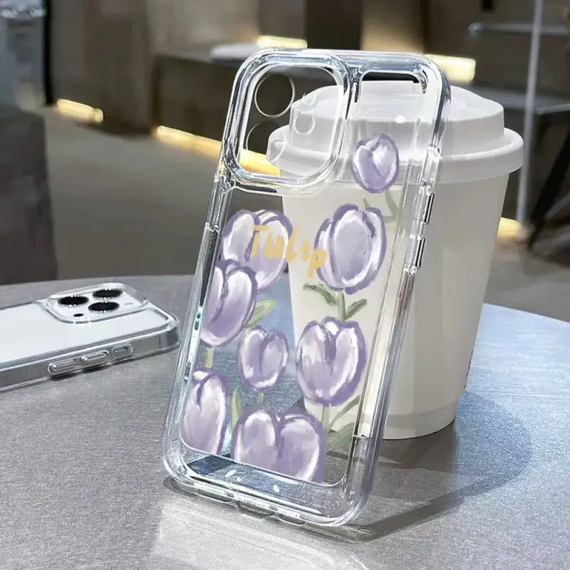 A phone case with purple flowers on it