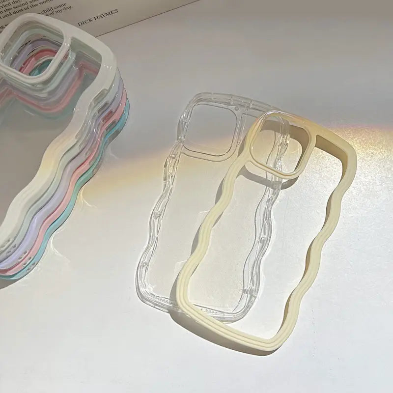 a white phone case with a rainbow colored design