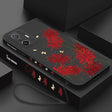 A phone case with red flowers on it