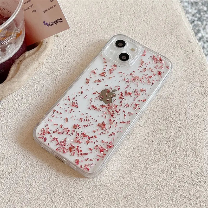 a phone case with a red flower pattern on it