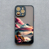a phone case with a landscape of mountains and trees