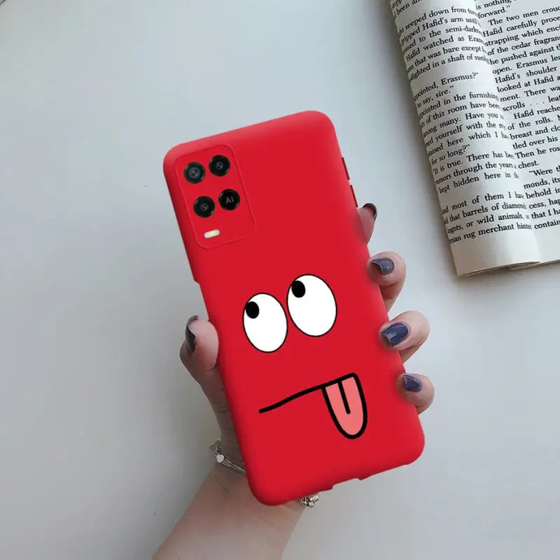 a red phone case with a cartoon face on it