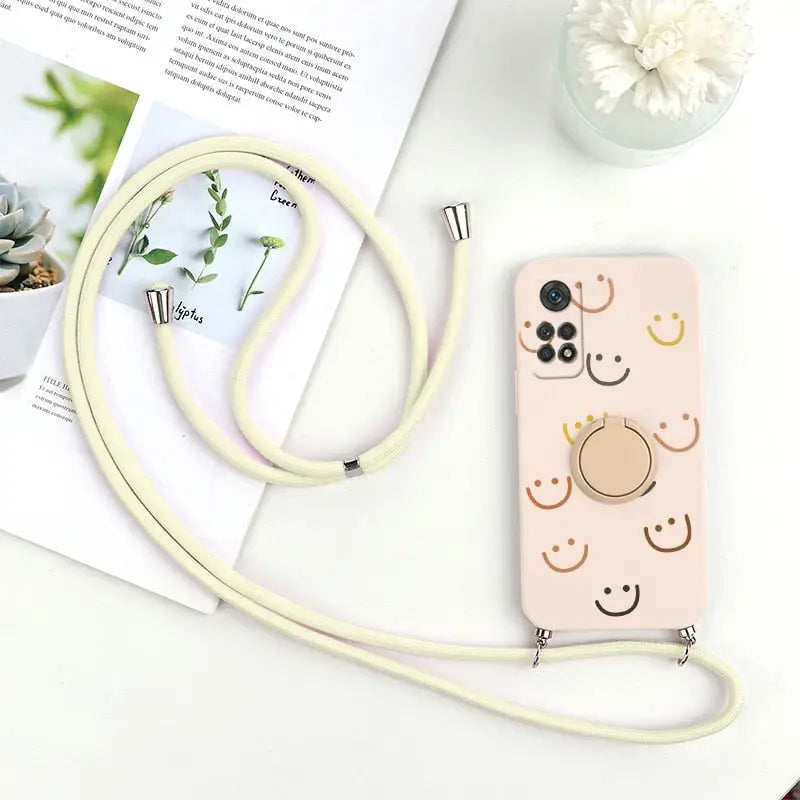 a phone case with a strap and a flower