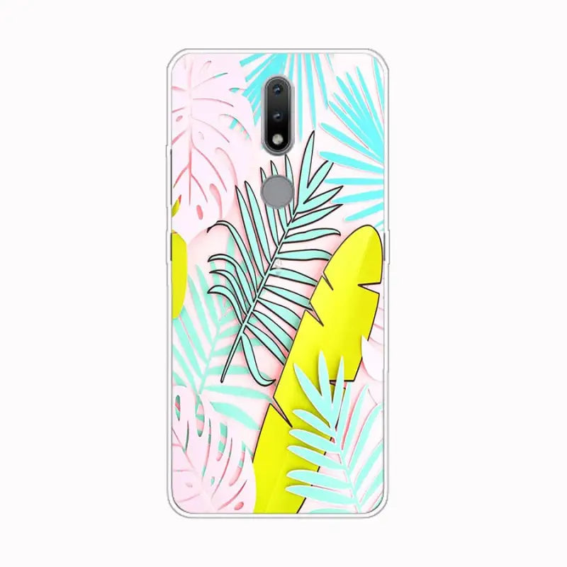a phone case with tropical leaves and palm leaves